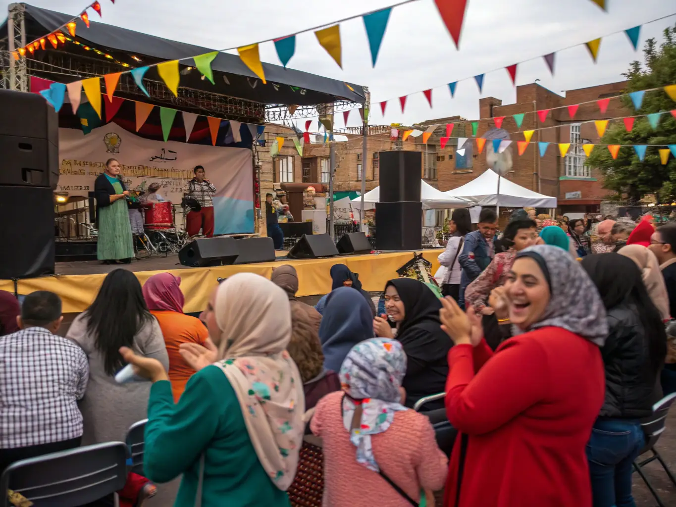 A captivating shot of a community event organized by TOTAL HEAVEN, featuring diverse performers and attendees. The atmosphere is lively and celebratory, emphasizing the organization's role in fostering community spirit.